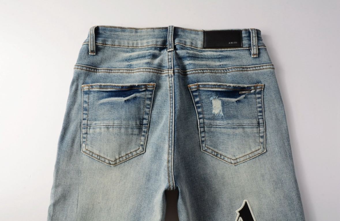 Men’s Mike AMIRI Distressed Staggered Logo Light Blue Jeans