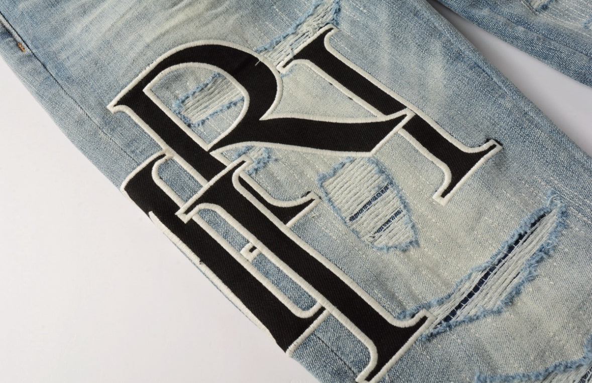 Men’s Mike AMIRI Distressed Staggered Logo Light Blue Jeans