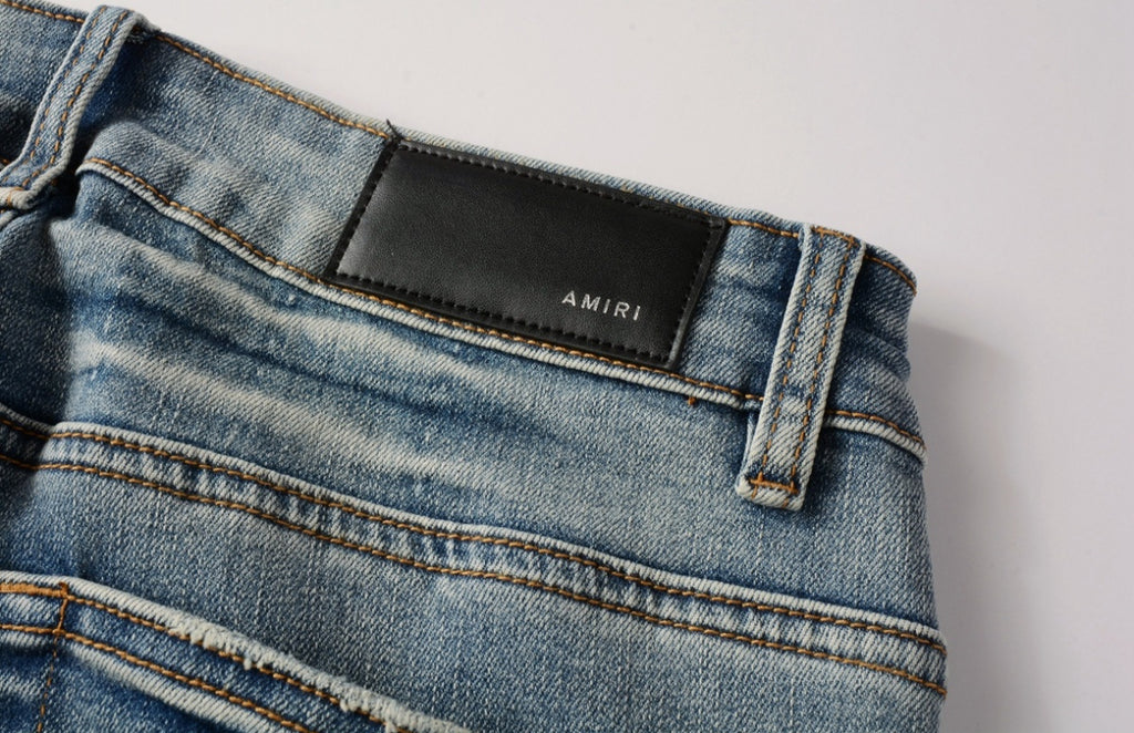 Men’s Mike AMIRI Distressed Staggered Logo Light Blue Jeans