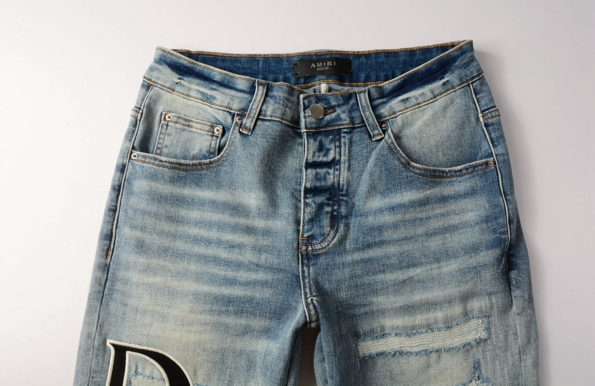 Men’s Mike AMIRI Distressed Staggered Logo Light Blue Jeans